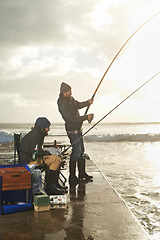 Image showing Friends, men and fishing on pier at beach with rod, water and relax on vacation, holiday and travel. Friendship, people and bonding in morning with overcast, sky and nature for activity and hobby