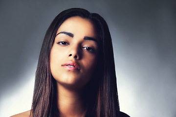 Image showing Portrait, skincare and beauty of serious woman, shine and glow in spa isolated on a grey studio background. Face, aesthetic and natural model in cosmetics for dermatology, wellness and healthy skin