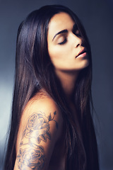 Image showing Hair, beauty and woman with skin, cosmetics treatment or keratin for growth and tattoo on grey background. Dermatology, long and straight hairstyle with haircare, wellness and skincare in studio