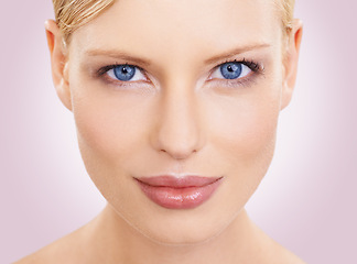 Image showing Portrait, skincare and woman with cosmetics, makeup and beauty on a pink studio background. Face, person or model with shine and facial with wellness or dermatology with aesthetic and natural glow