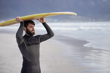 Image showing Surfboard, thinking and man on beach for surfing on vacation, holiday and weekend in ocean. Nature, waves and person in wetsuit for water sports, hobby and exercise for adventure and freedom in sea