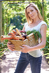 Image showing Woman, portrait and basket for vegetables harvest for small business or agriculture, production or sustainability. Female person, face and carrots or beetroot or eco farming career, organic or diet