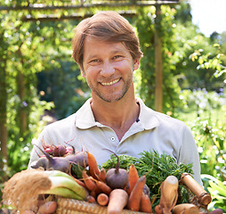 Image showing Farmer, portrait and basket for vegetables agriculture for small business or gardening, production or sustainability. Male person, face and carrots or beetroot for eco friendly, nutrition or diet