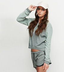 Image showing Fashion, cap and woman portrait in studio with attitude, confidence and casual style on white background. Trendy, face and female model posing in cool, edgy or streetwear clothes or outfit choice