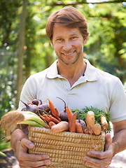 Image showing Man, portrait and basket for vegetables harvest for small business or agriculture, production or sustainability. Male person, face and carrots or beetroot forr eco farming career, gardening or diet
