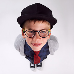 Image showing Glasses, happy and portrait of child in studio for eye care, vision and optical health. Smile, optometry and top view of young boy kid with stylish eyewear or spectacles isolated by gray background.