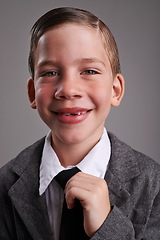 Image showing Smile, fashion and portrait of child in studio with classy, fancy and trendy shirt and tie. Happy, cute and young boy kid with elegant style, confidence and positive attitude by gray background.