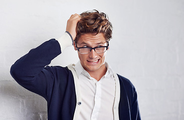 Image showing Business, stress and frustrated man with hands in hair for crisis, disaster or panic on wall background. Doubt, overthinking and male entrepreneur with startup risk, fail or bankruptcy and anxiety