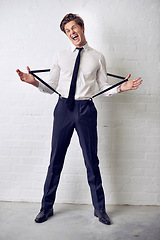 Image showing Man, funny and fashion with crazy, confidence and suit with trendy and stylish clothes. Hipster, male person and wall with event, classic and fancy suspenders with dressing formal and funny joke