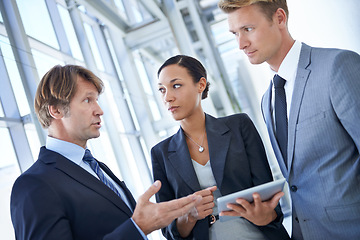 Image showing Discussion, teamwork and business people in office with tablet for legal company, law firm and collaboration. Corporate, attorney and lawyers on digital tech for research, website and networking