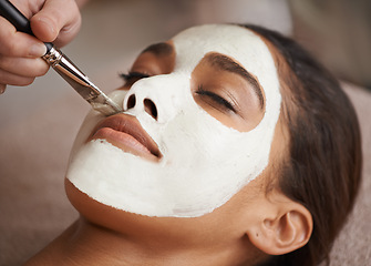 Image showing Skincare, brush and woman with face mask at spa for glow, wellness and beauty routine with self care. Cosmetic, natural and female person relaxing for clay facial dermatology treatment at salon.