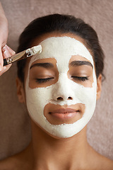 Image showing Skincare, beauty and woman with face mask at spa for glow, wellness and natural routine with self care. Cosmetic, pamper and female person relaxing for clay facial dermatology treatment at salon.