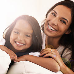Image showing Happy mom, portrait and child on sofa for love, bonding or care with lens flare at home. Face of mother, parent or little girl, daughter or kid with smile in living room for family weekend or support