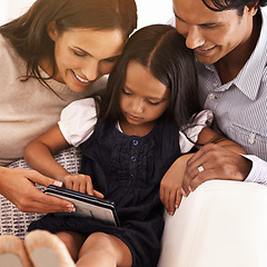 Image showing Happy parents, child and tablet for entertainment, social media or games on sofa at home. Mother, father and daughter on technology for online streaming, movie or reading ebook in elearning at house