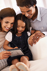 Image showing Happy family, tablet and entertainment on living room sofa for social media, games or reading ebook at home. Mother, father and daughter on technology for online streaming, internet or app at house