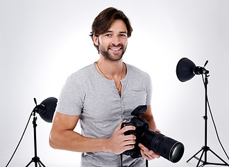 Image showing Photography, portrait and happy with camera in studio for career, behind the scenes and backpack. Photographer, person or smile with equipment, mockup space or shooting gear for photoshoot or passion