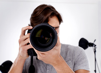 Image showing Portrait, closeup and male photographer with camera lens for studio, casting pictures and photoshoot in USA. Professional videographer, man and DSLR for fashion, digital or macro photography session