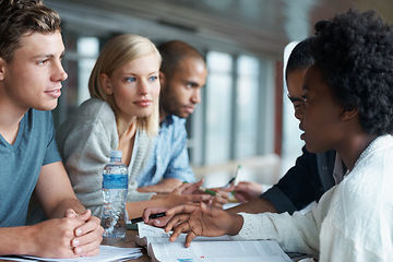 Image showing Education, university and students studying and reading together, share ideas and research for project. People in library, academic discussion for assignment on campus, diversity and scholarship