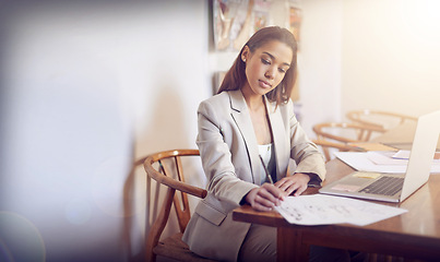 Image showing Professional, planning and woman writing research on paper for business, schedule and agenda. Entrepreneur, working and ideas in notes for report or analysis on table with laptop in home living room