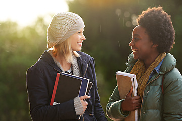 Image showing College, books and conversation with woman friends outdoor on campus together for learning or development. Education, school or university with young student and best friend talking at recess break