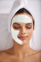 Image showing Happy woman, relax and face mask at spa for skincare, beauty or makeup cosmetics at hotel or resort. Calm female person or model with smile in satisfaction for facial treatment, zen or anti aging
