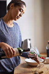 Image showing Woman, pouring red wine and home for dinner, relax for peace and leisure with drink in kitchen. Alcohol, glass and bottle with refreshment, hydration with beverage to celebrate or chill in apartment