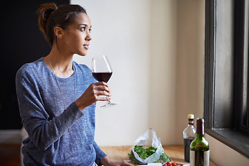 Image showing Woman, red wine and thinking in kitchen, reflection and future, drink and food for cooking at home. Relax with alcohol in glass, inspiration or insight with memory, enjoy and wellness with beverage