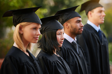 Image showing Face, graduation and woman student in line with friends at outdoor ceremony for college or university. Education, scholarship or achievement with graduate men and women at academic school event