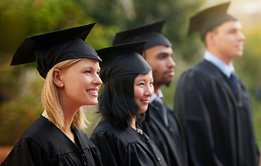 Image showing Smile, graduation and woman student in line with friends at outdoor ceremony for college or university. Education, scholarship or achievement with graduate men and women at academic school event