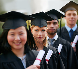 Image showing Portrait, graduation and woman in line with friends at college or university for ceremony of achievement. Education, certificate and scholarship with group of young graduate people outdoor on campus