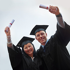 Image showing Portrait, graduation and success with couple of friends on overcast sky for celebration at ceremony. Smile, future or certificate with man and woman student outdoor at university or college together