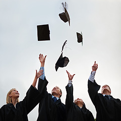 Image showing Graduation, mortar and throw with student friends outdoor on campus for celebration at university ceremony. School, winner and air with graduate group together at college for success or achievement