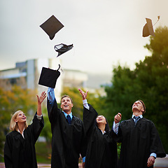 Image showing Graduation, mortar in air and student friends outdoor on campus for celebration at university ceremony. Education, winner and throw with graduate group together at college for success or achievement