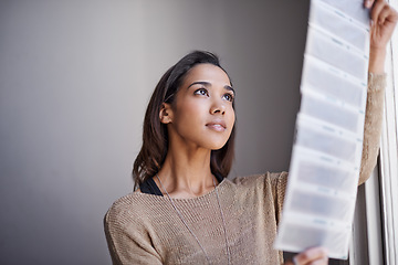 Image showing Photography, woman and photographer with negatives for photo by window with filmstrip, project and freelancer. Artist, creative and artistic hobby, art and portfolio with examine, looking and study