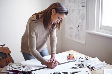 Image showing Woman, photography and paper for creative project with images for art portfolio, planning or professional. Female person, pencil and ruler in studio with picture prints or magazine, proposal or hobby