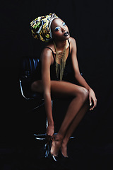 Image showing Black woman, fashion and portrait with confidence, head dress and makeup in studio. Cosmetics, trendy and beauty with African female person from Kenya with traditional hair wrap with dark background