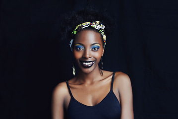 Image showing African woman, fashion and studio for makeup, beauty and smile for eye shadow campaign. Black female model, dark background and cosmetic, portrait and face for cultural, style and elegance