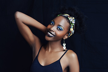 Image showing African female person, fashion and studio for makeup, lipstick and smile for eye shadow. Black woman model, dark background and cosmetic, portrait and face for cultural, style and elegance