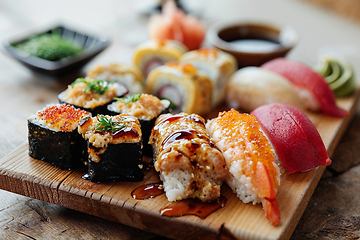 Image showing Delicious Sushi Selection on a Wooden Platter