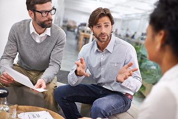 Image showing Businessman, documents and meeting with team in discussion for planning, brainstorming or finance at office. Young group of employees with paperwork in budget, strategy or financial plan at workplace