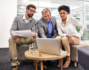 Image showing Business people, laptop and teamwork with documents for planning, brainstorming or strategy at office. Businessman, CEO or executive showing employees project on computer for research and development