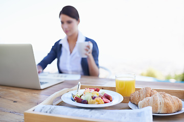 Image showing Food, laptop and breakfast outdoor, woman and table with healthy meal, freelancer and online. Person, worker and writing with technology, pc and creative with coffee in remote work and business