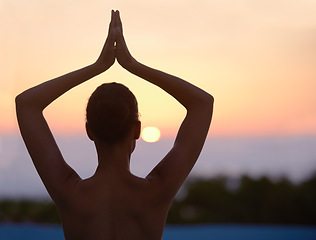 Image showing Vrikshasana, yoga and woman meditate at sunset for healthy body, wellness and zen for mindfulness outdoor. Rear view, tree pose and person at twilight to relax, peace or calm to balance for exercise