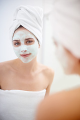 Image showing Woman, portrait and facial mask in mirror for skincare, .smile and bathroom for facial, beauty and cosmetic. Female person, towel and facemask, reflection and treatment for wellness and cleanliness