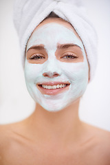 Image showing Women, portrait and face mask for skincare, smile and bathroom getting ready for organic spa day. Female person, towel and shower while happy about treatment for wellness or cleanliness and facial