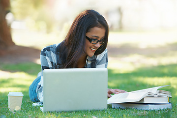 Image showing Laptop, grass or happy woman in park with books for learning knowledge, information or education. Smile, textbooks or female student in nature for studying history or typing online on college campus