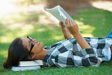 Image showing Relax, grass or happy woman in park reading book for learning knowledge, information or education. Smile, textbook or student in nature for studying history, story or novel on college campus lawn