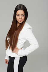 Image showing Fashion, hair and style with confident woman in studio isolated on gray background for shampoo treatment. Casual, clothes and outfit with young haircare model at salon for cosmetics or keratin