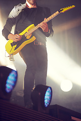 Image showing Man, stage and guitar for performance at concert, music festival or live event in Amsterdam. Male artist, electric instrument and playing on stage for crowd, people or audience with enjoyment