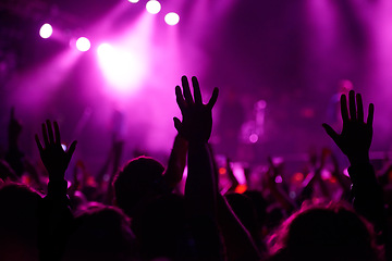 Image showing Hands, crowd and silhouette at music festival with dancing for rock party at concert with stage lights, nightclub or dj. People, dance floor and holiday event in summer for entertainment, dark or fun